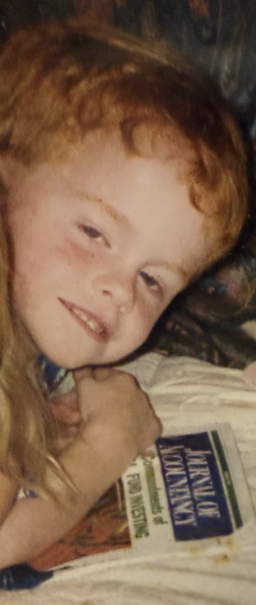 Young Lee reading the Journal of Accountancy
